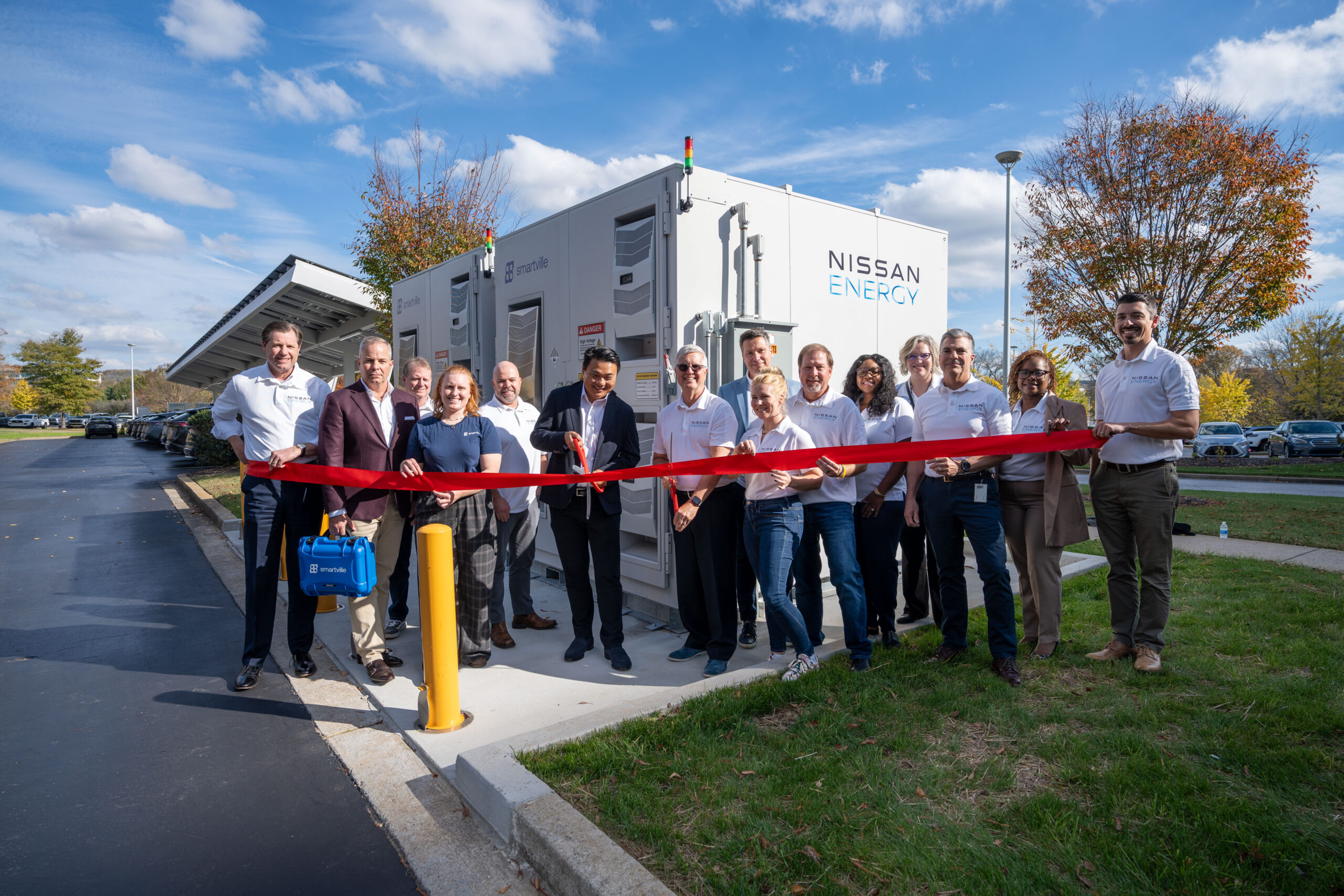 Ribbon-cutting at Nissan North American HQ inaugurating Smartville's battery ground-breaking energy storage system with Nissan and Smartville leadership and project team members.